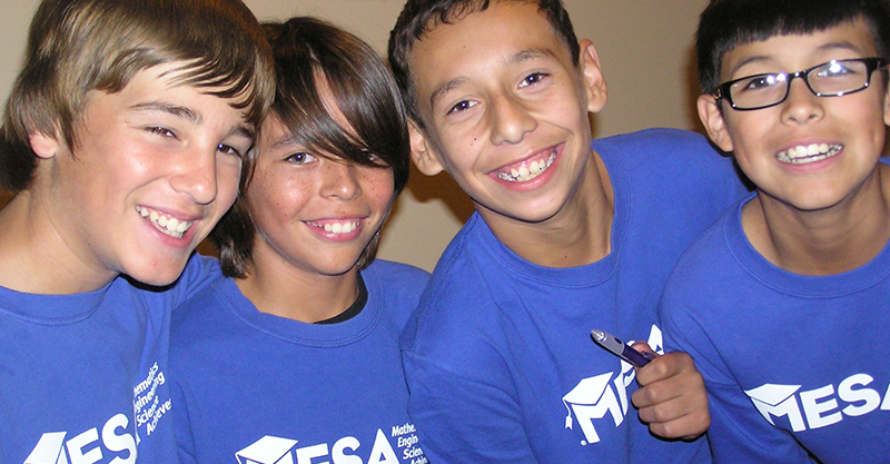 4 young boys in MESA t-shirts